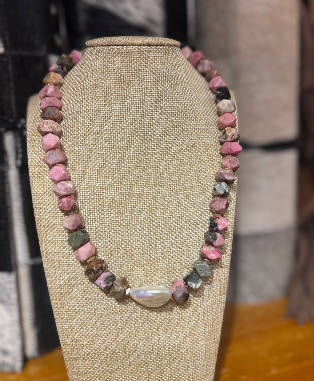 Faceted natural pink rhodonite with a freshwater Keshi pearl