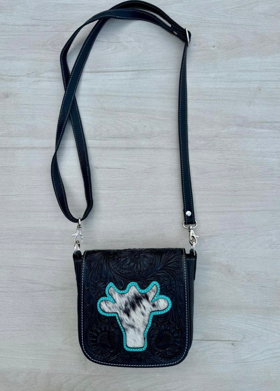 Bullhead tooling leather sling bag