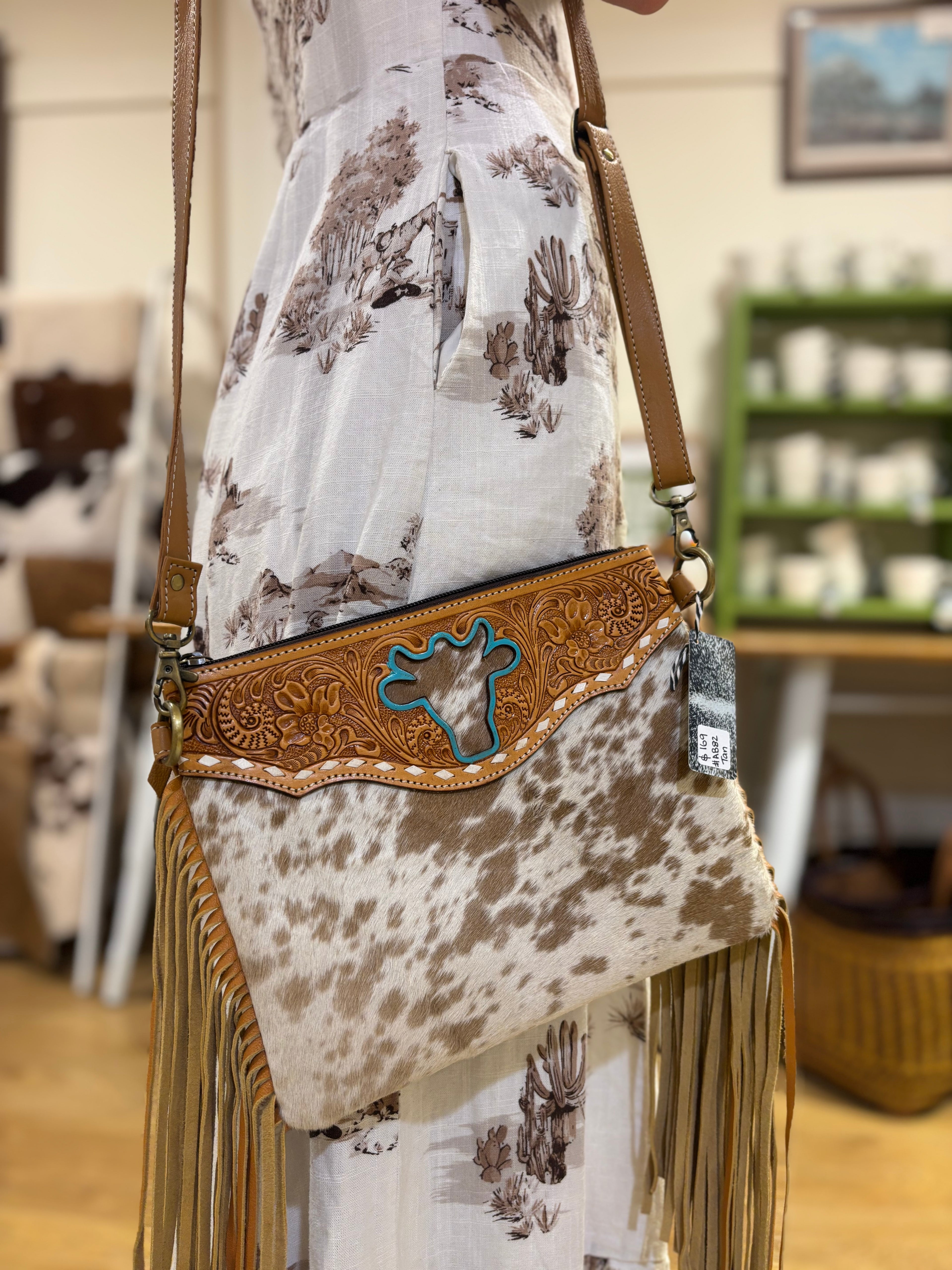 Bullhead cowhide sling bag with fringes