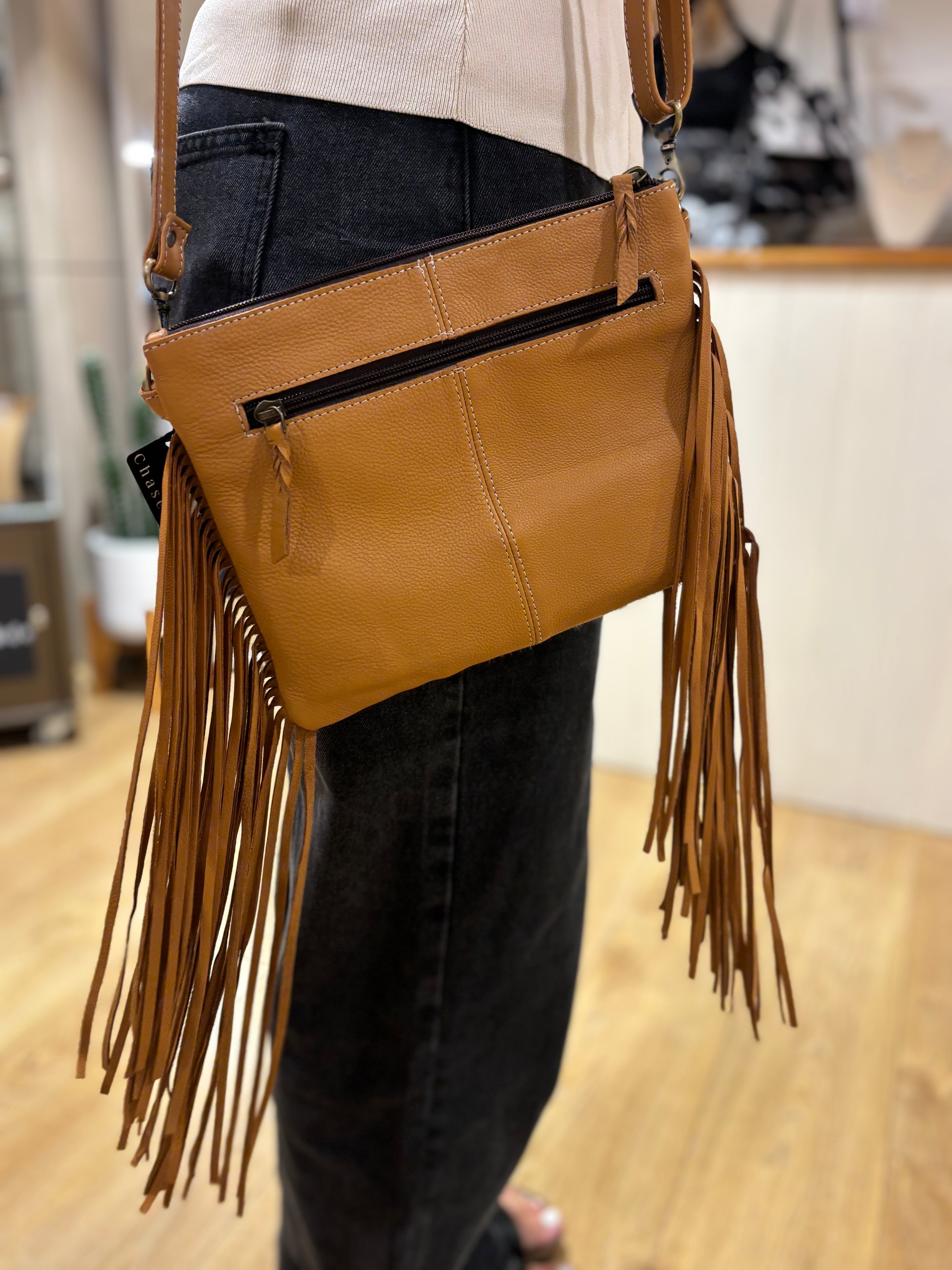 Bullhead cowhide sling bag with fringes