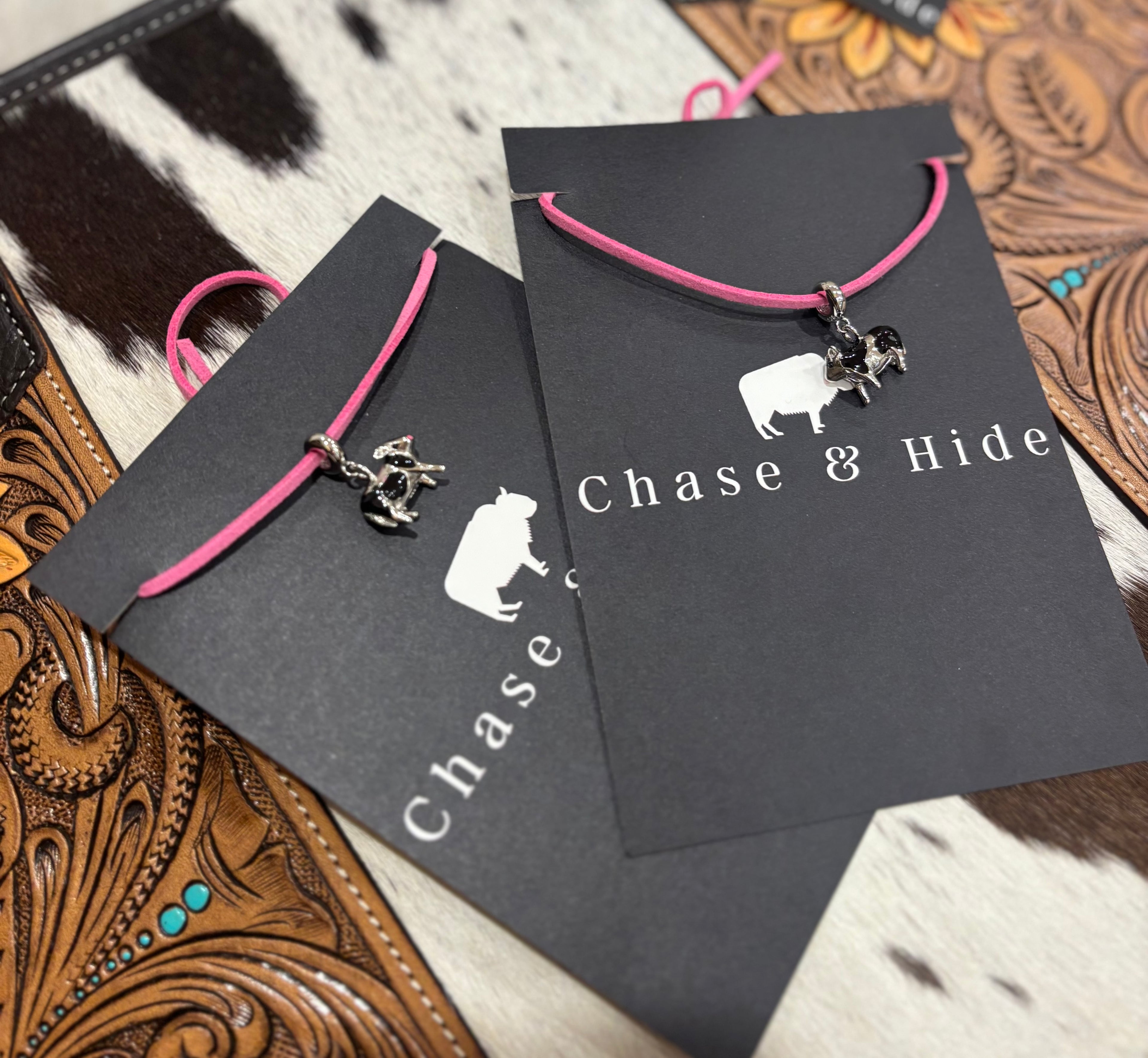 Silver Cows charm on pink leather lariat