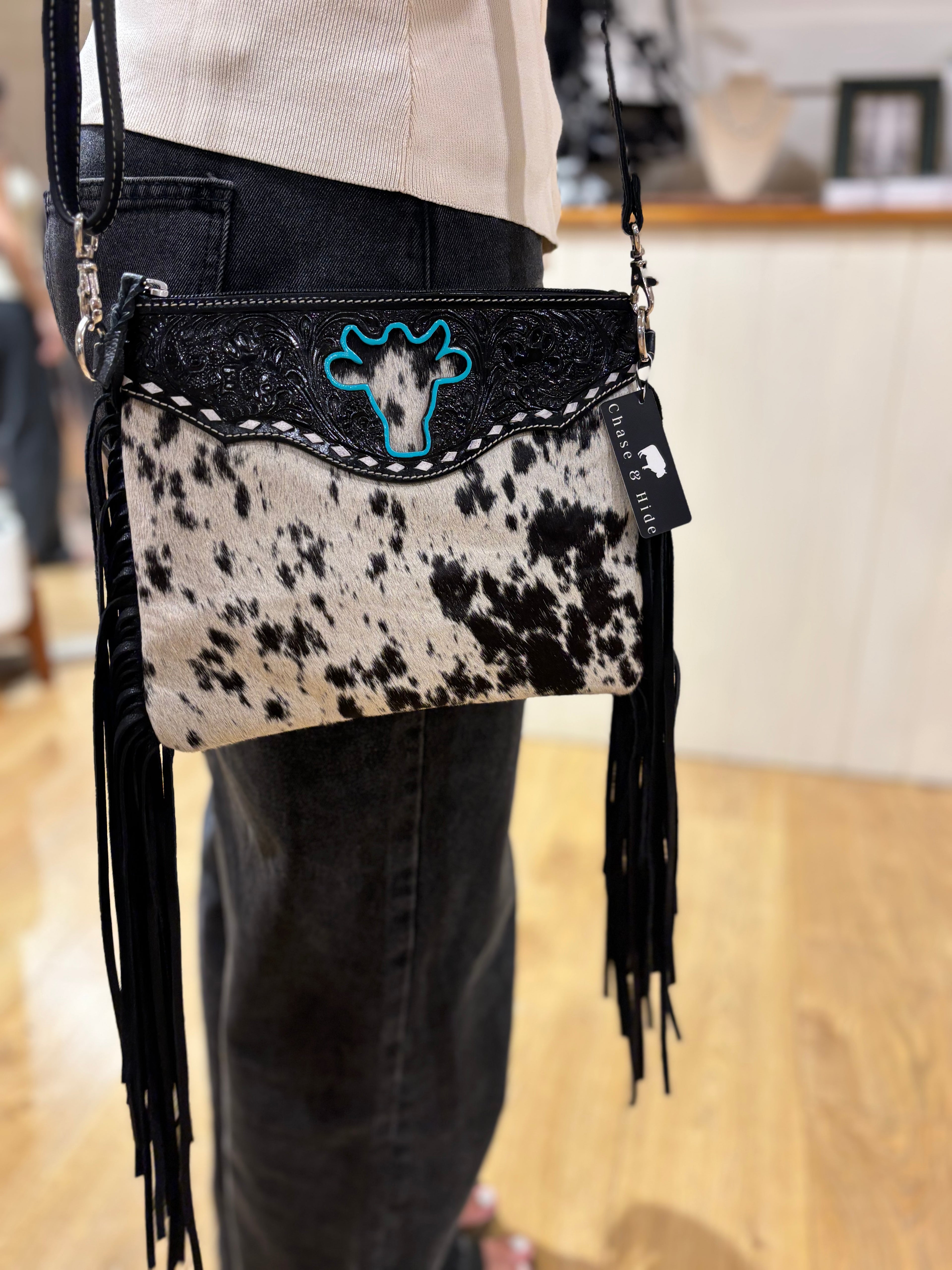 Bullhead cowhide sling bag with fringes