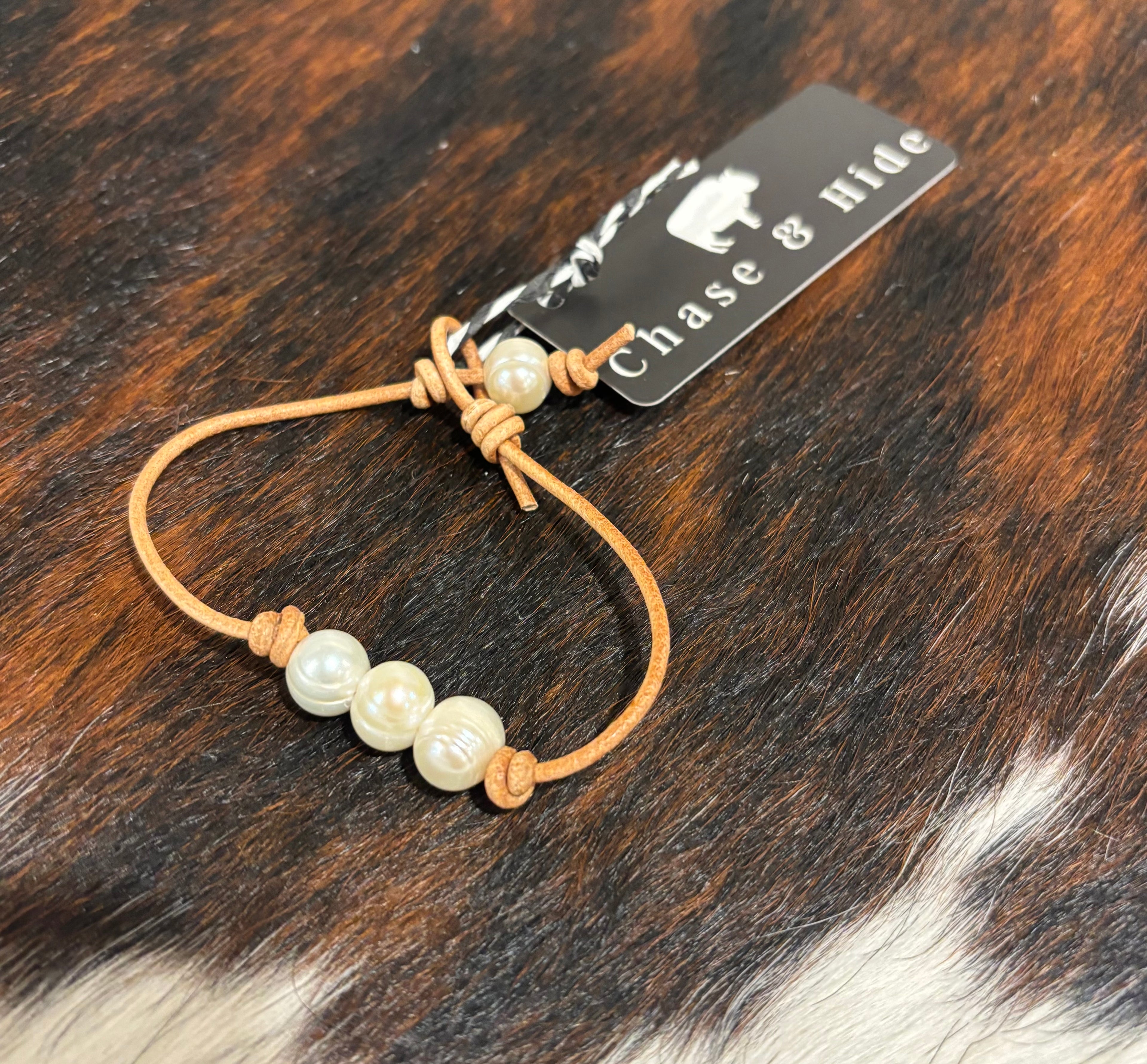 Pearls on light tan leather bracelet