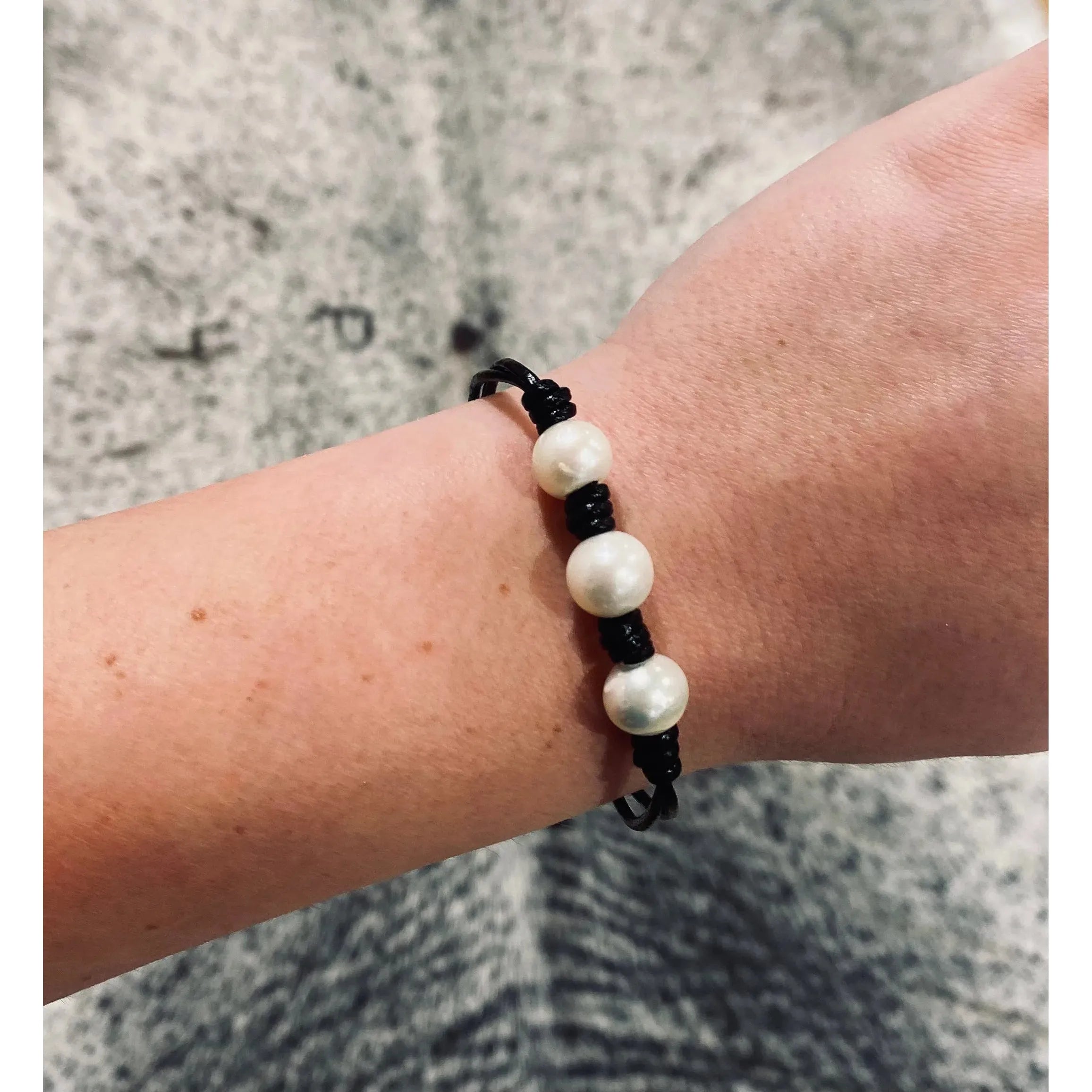 Black leather and pearl bracelet