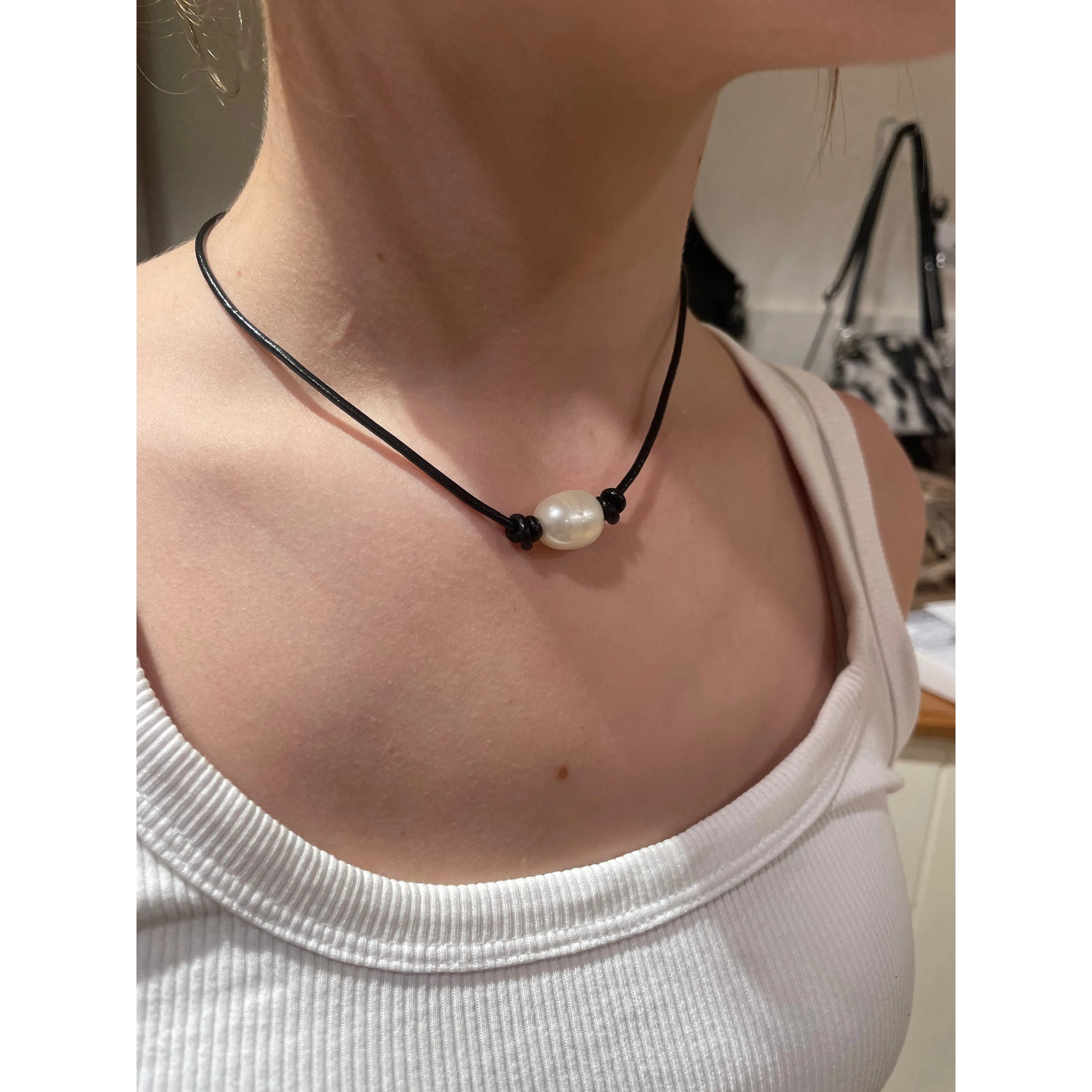 Single pearl on black leather choker / necklace