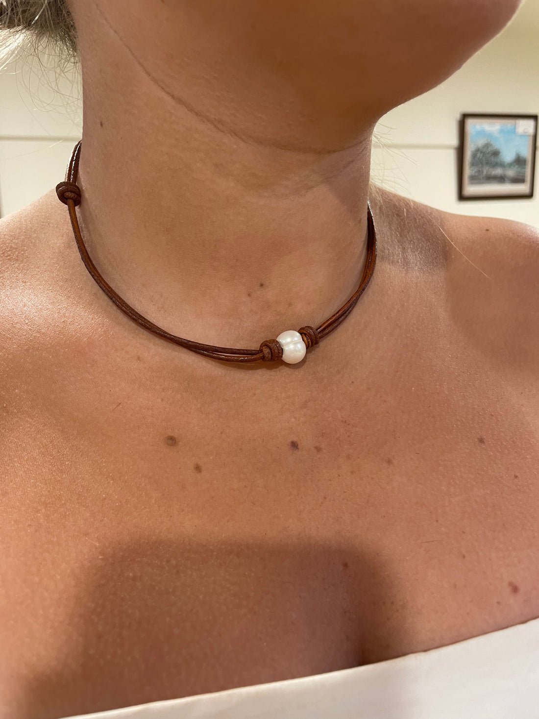 Single freshwater pearl on dark tan leather necklace