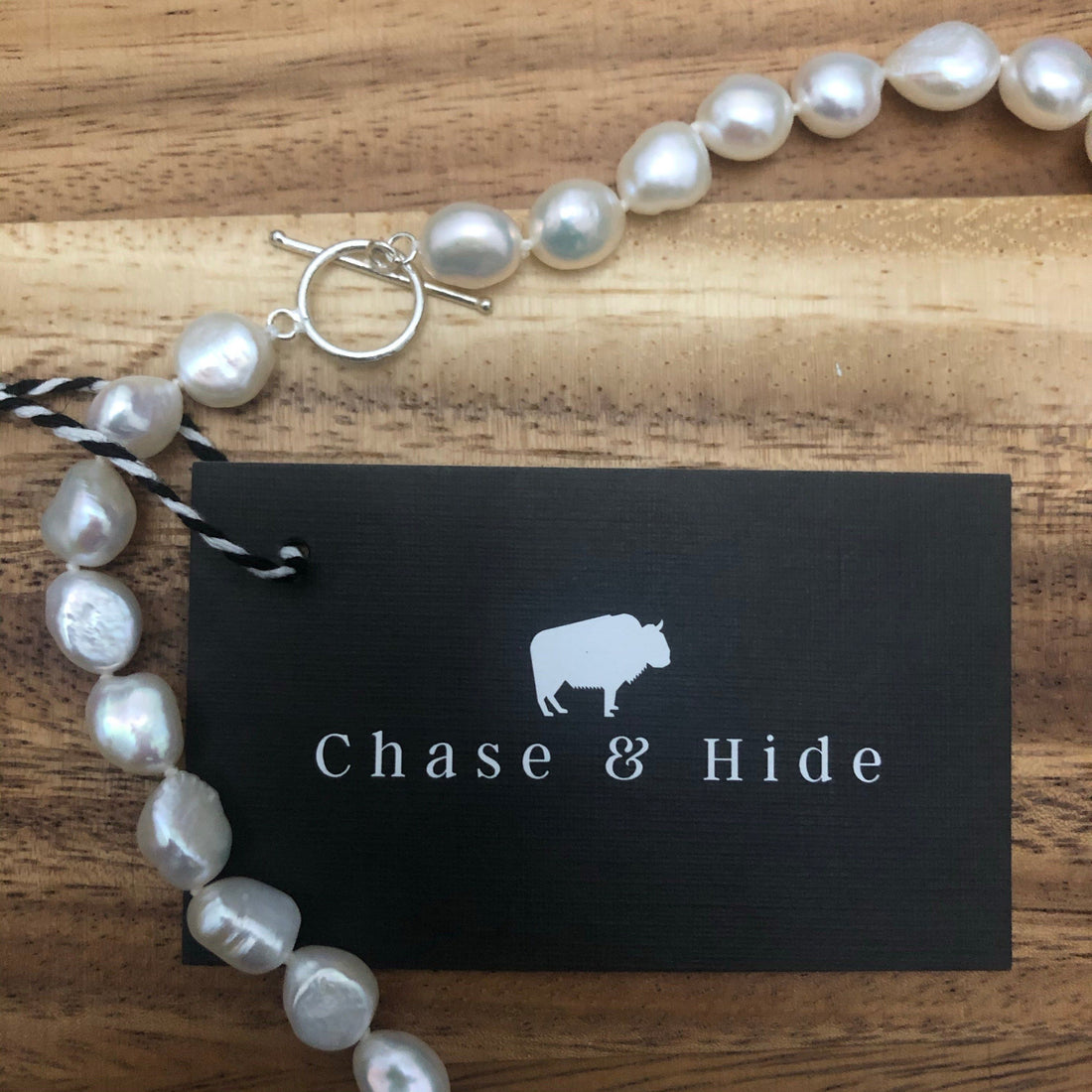 Freshwater potato pearl with silver fob.