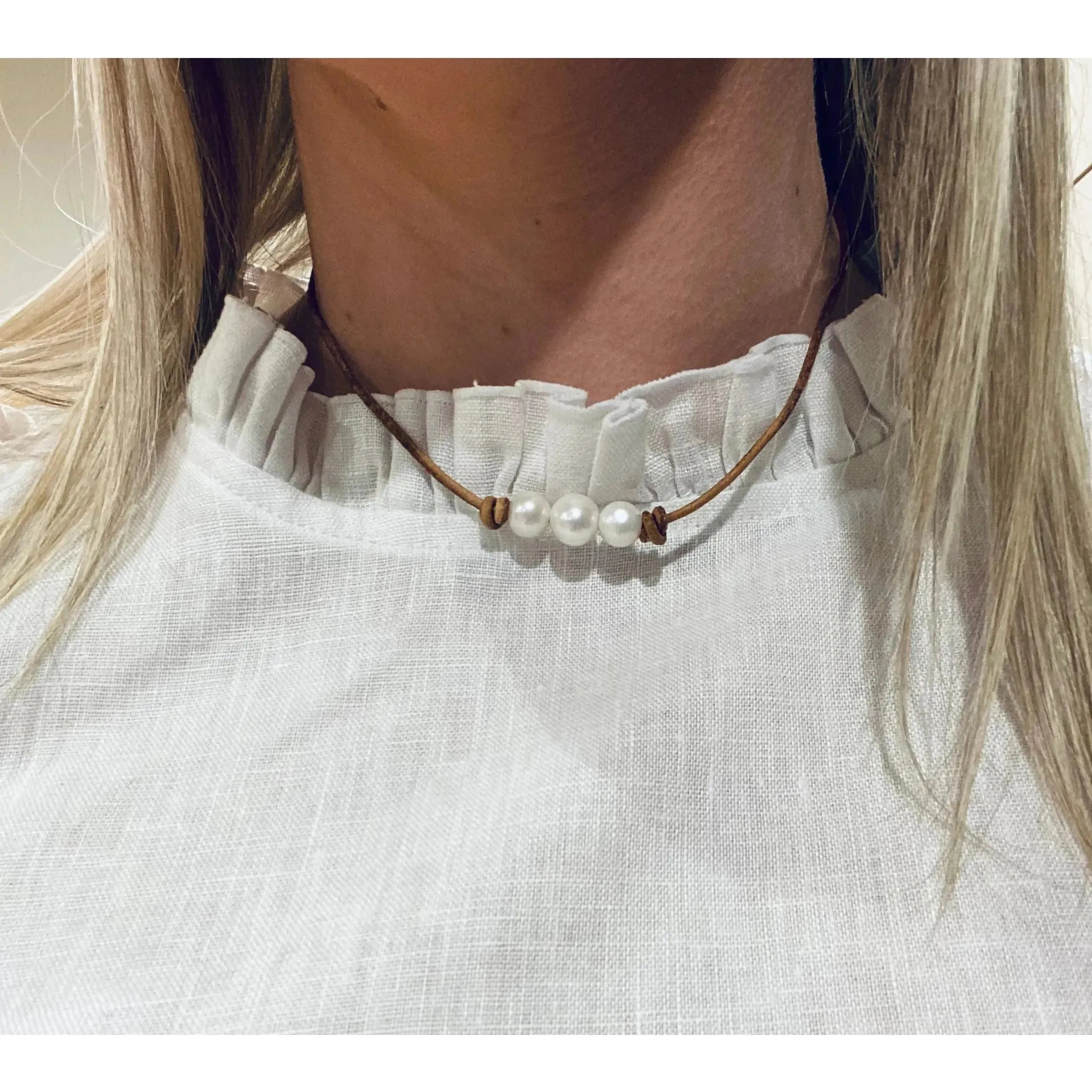 Pearls on light leather choker / necklace