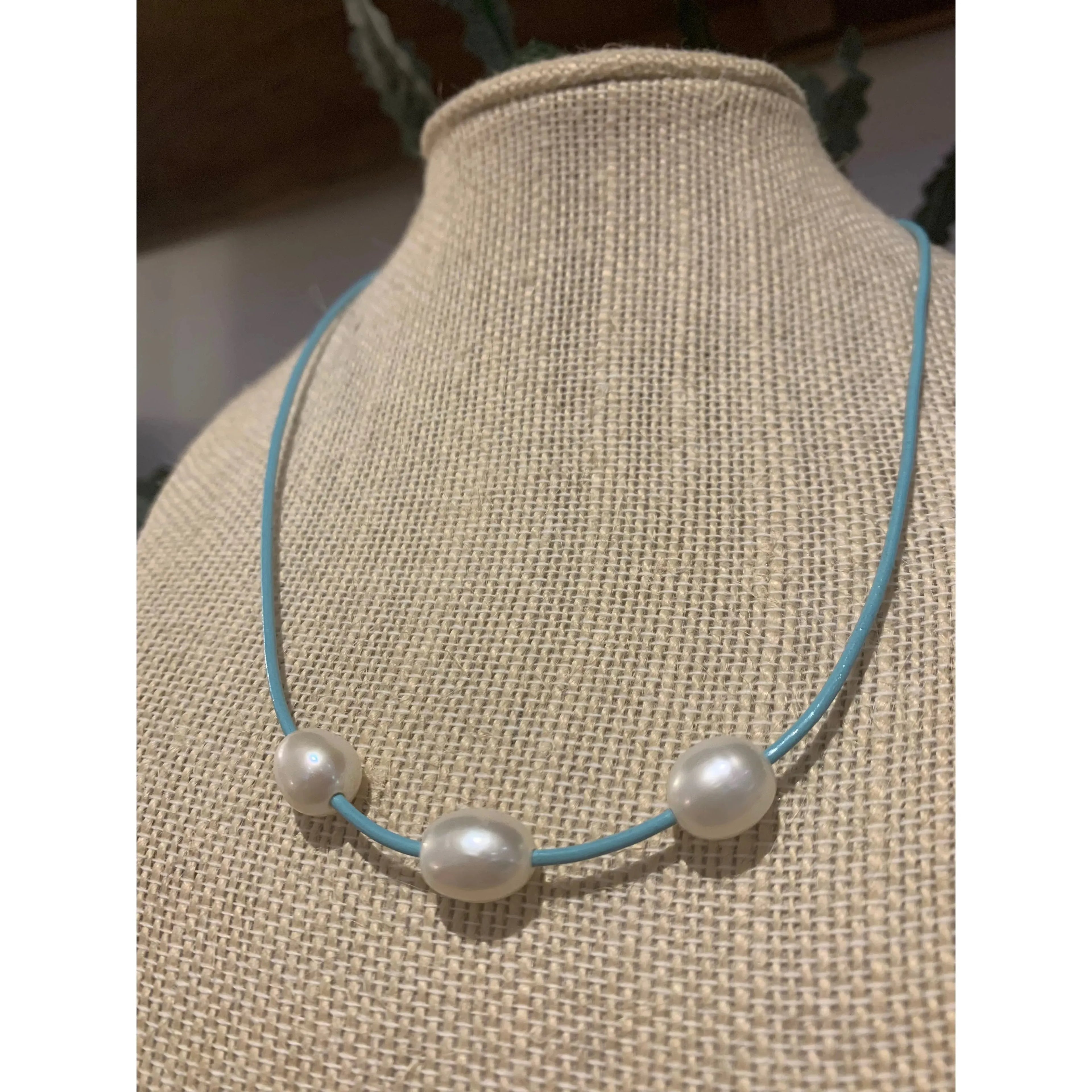 Fresh water pearls on blue cord