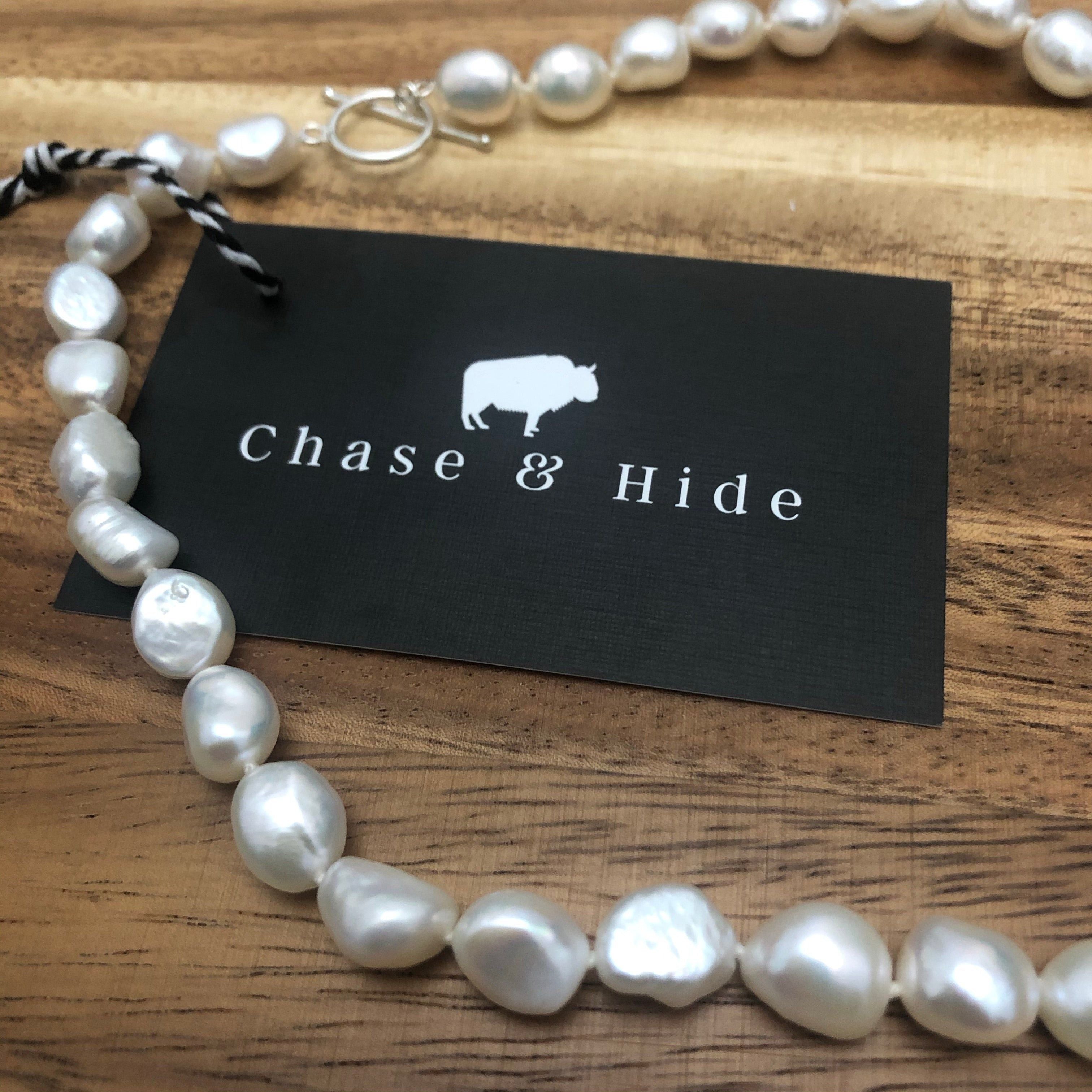 Freshwater potato pearl with silver fob.