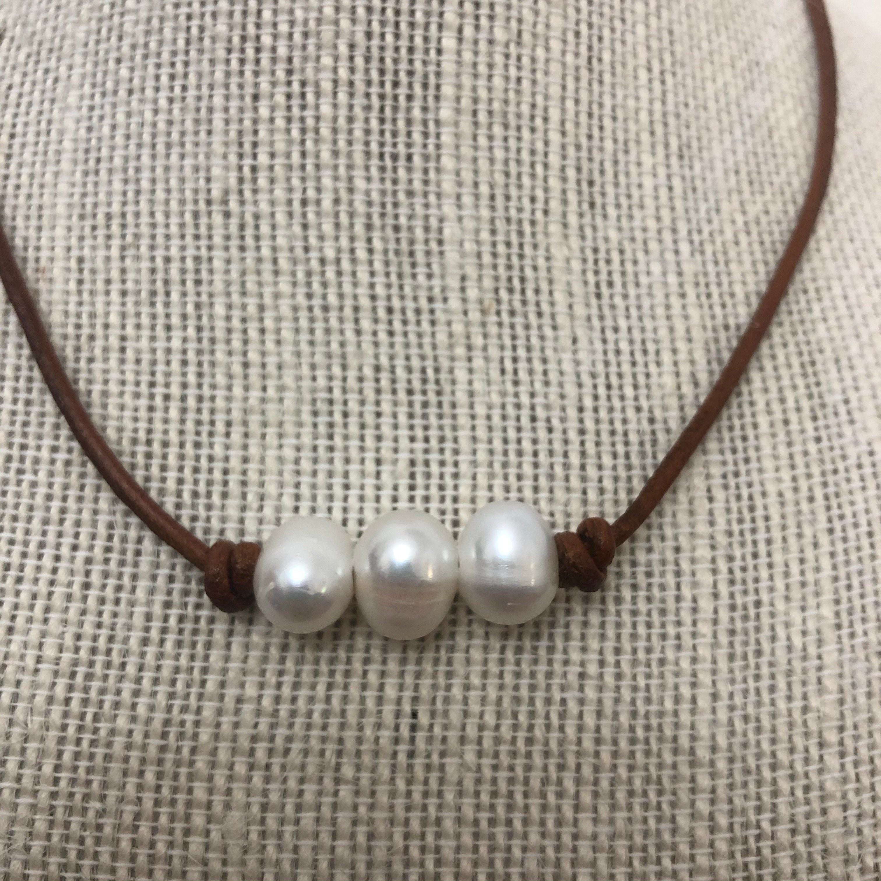 Pearls on dark tan leather