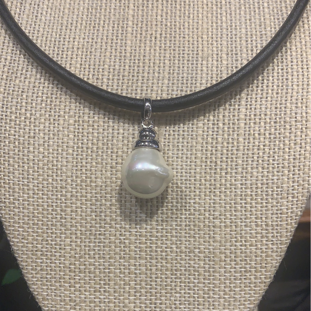 Spanish Faux Pearl displayed on thick leather cord necklace with silver detail