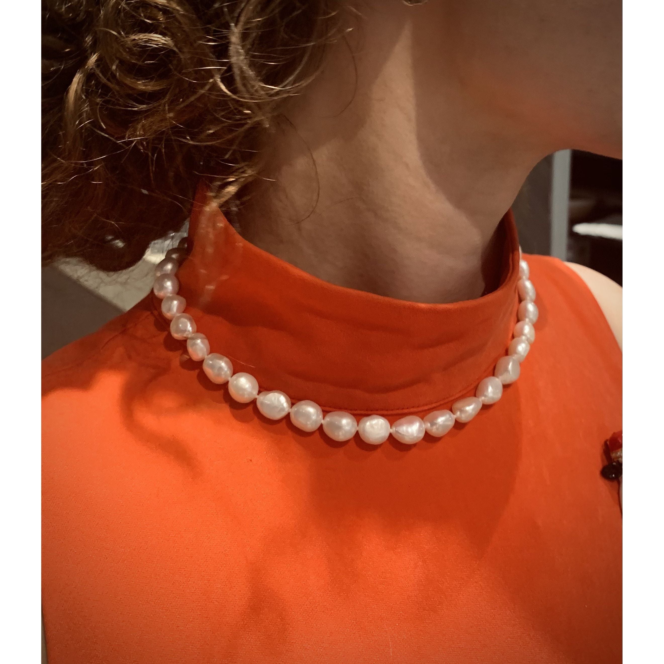 Freshwater potato pearl with silver fob.