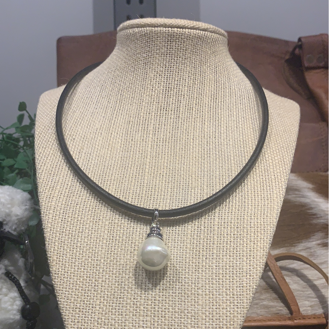 Spanish Faux Pearl displayed on thick leather cord necklace with silver detail