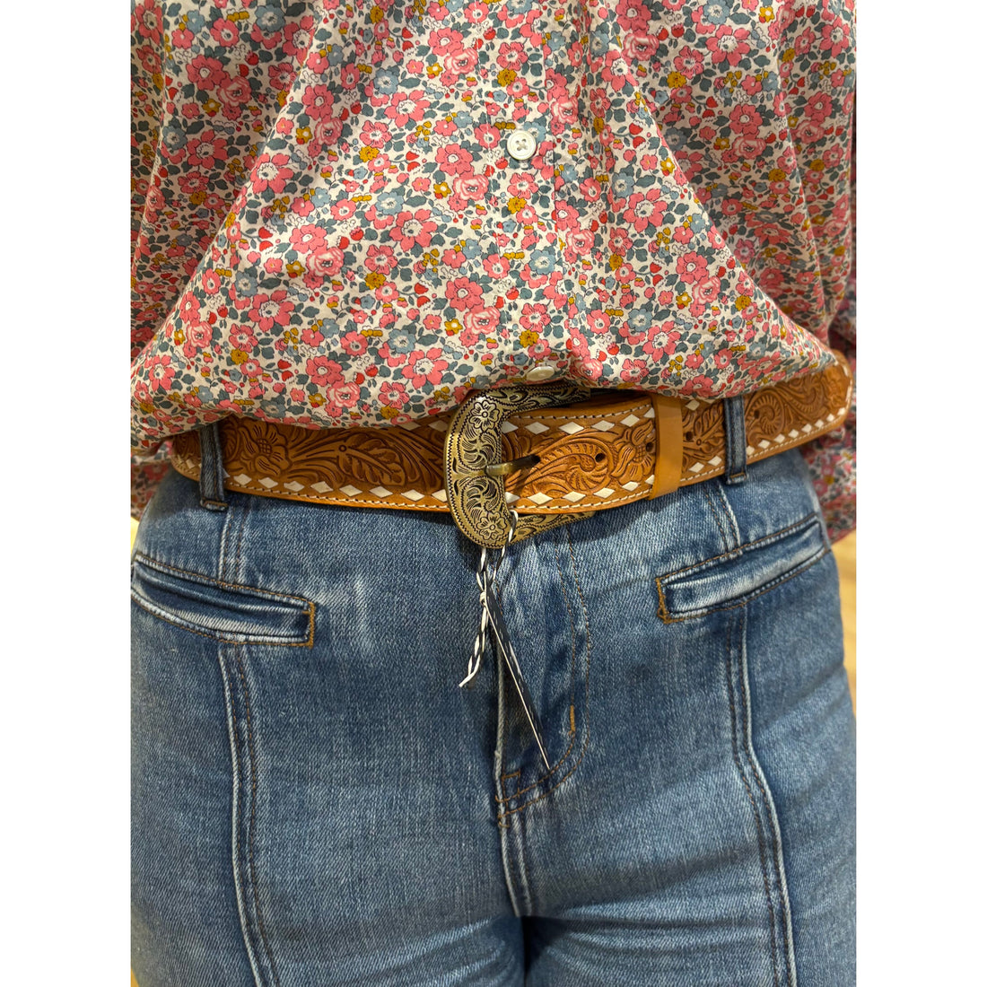 Tan stitched tooling leather belt