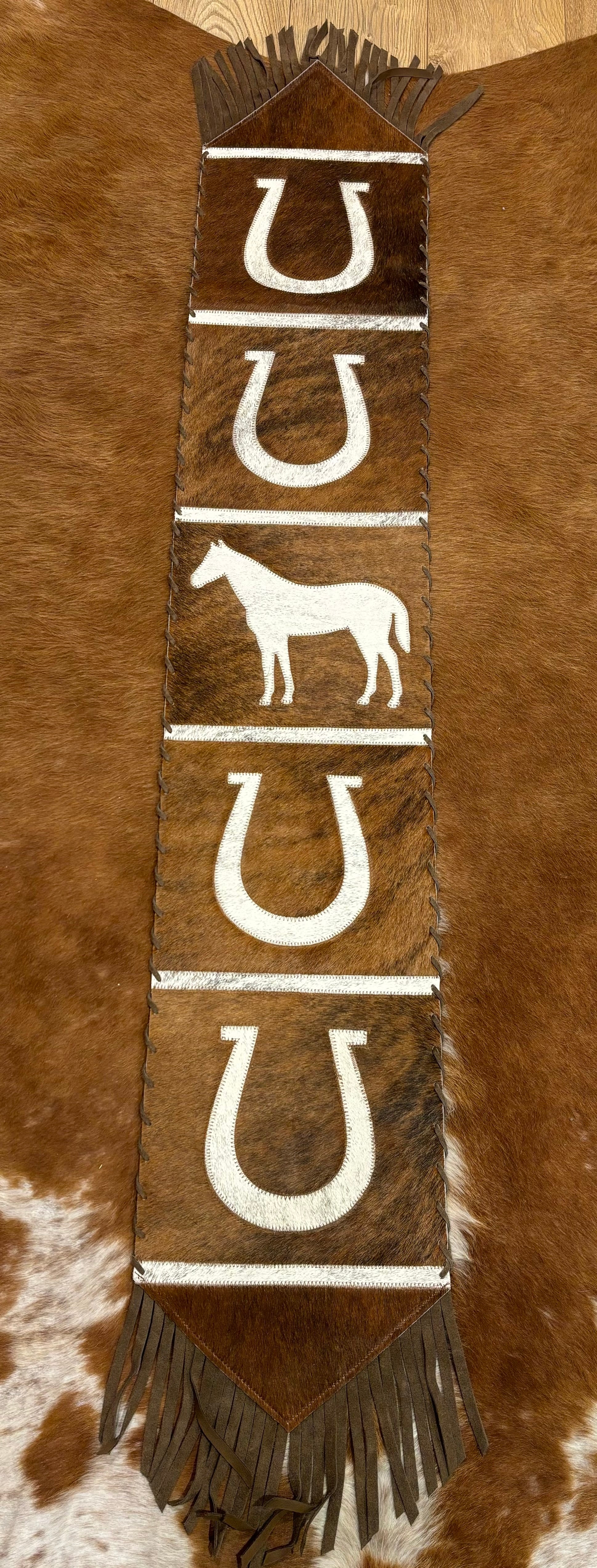 Cowhide table runner with tassels 