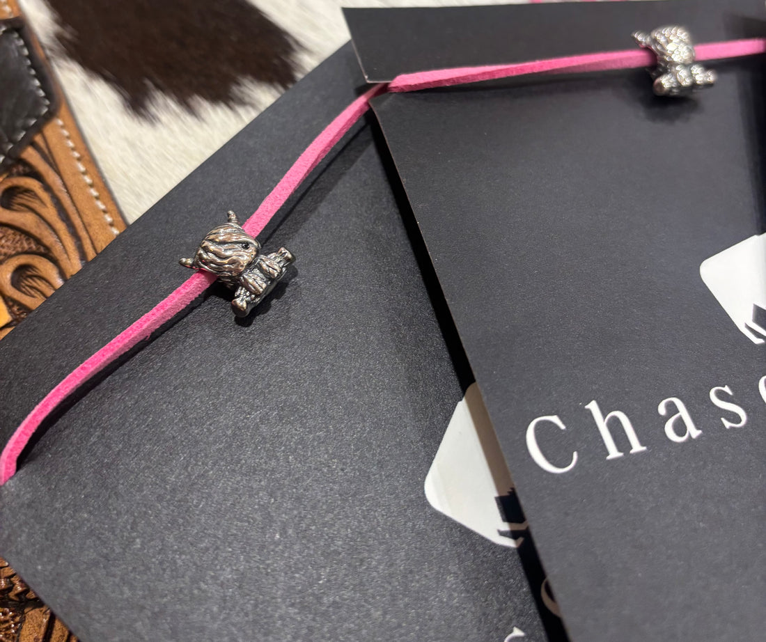 Silver Cows charm on pink leather lariat 