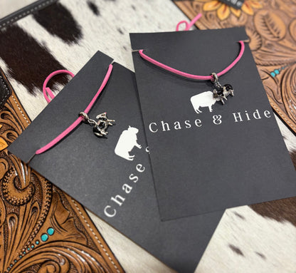 Silver Cows charm on pink leather lariat 