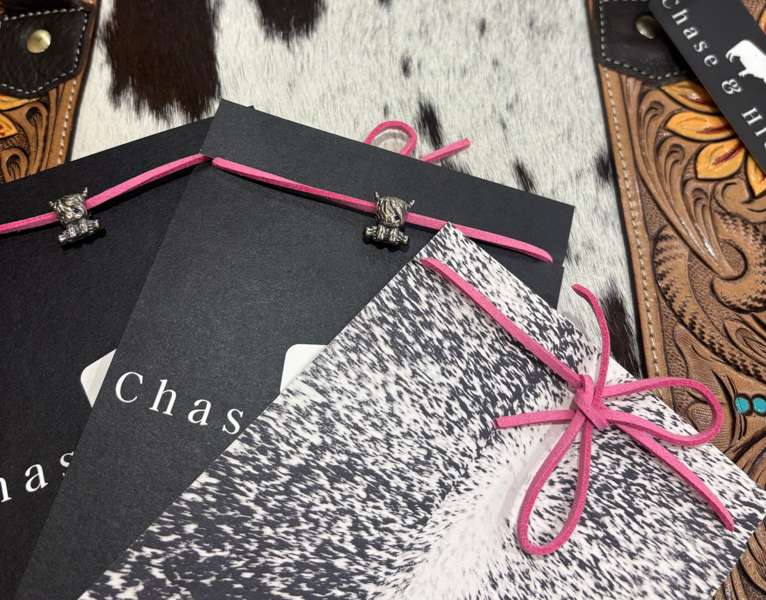 Silver Cows charm on pink leather lariat 