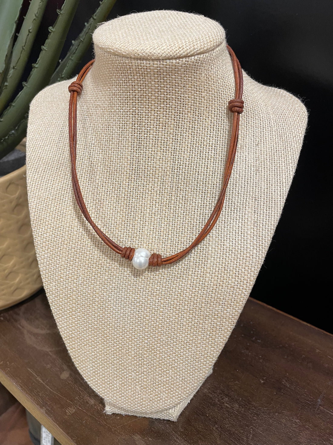 Single freshwater pearl on dark tan leather necklace