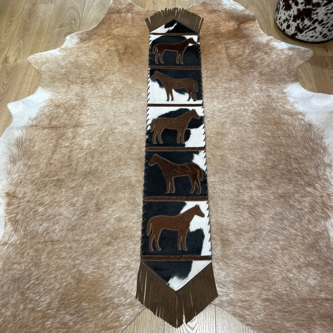 Cowhide table runner with tassels