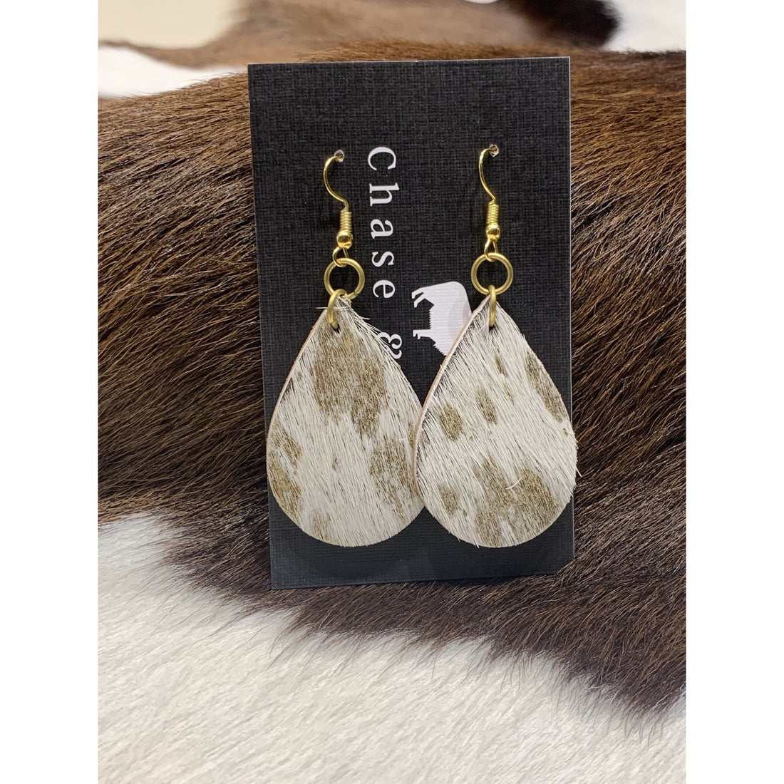 hide drop earrings white and gold assorted 