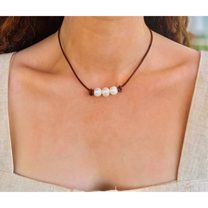 Three Pearls on red tan leather 