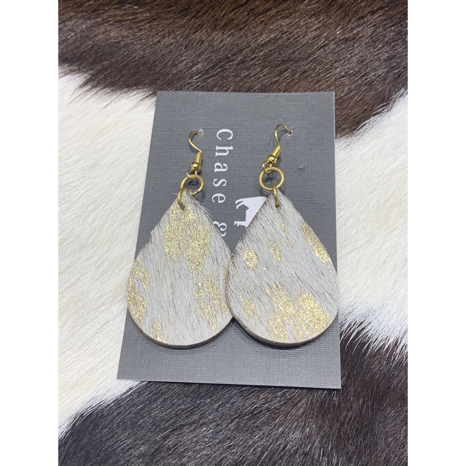 hide drop earrings white and gold assorted 
